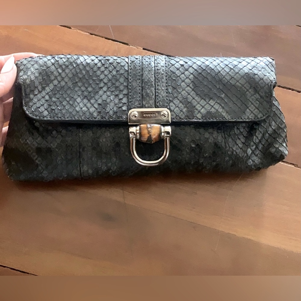 Barley used Gucci python clutch